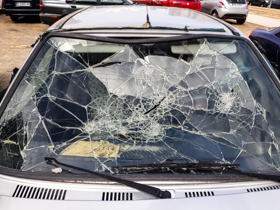 Car windshield broken by an accident.