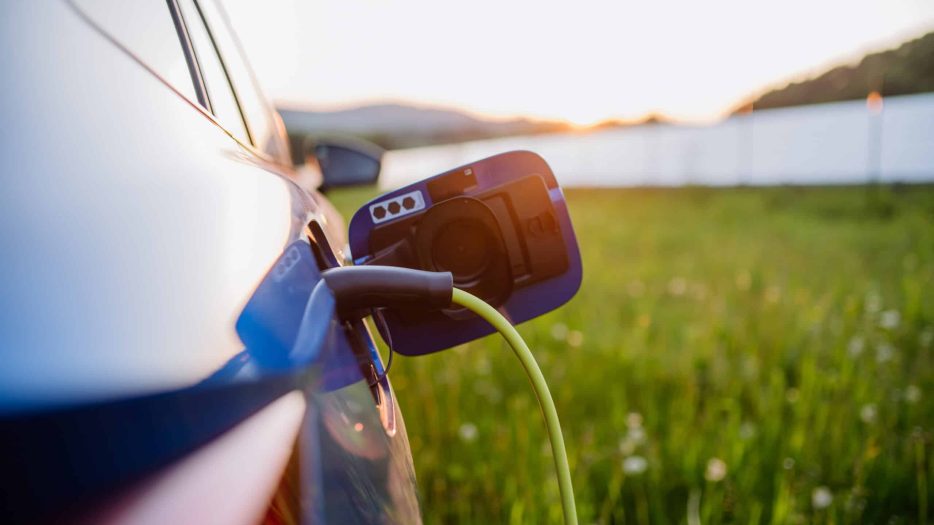 Close up of an electric car charging, concept of ecology and sustainability.